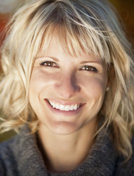 Woman smiling with Lumineers prepless veneers in Orange California