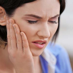 woman in tooth pain