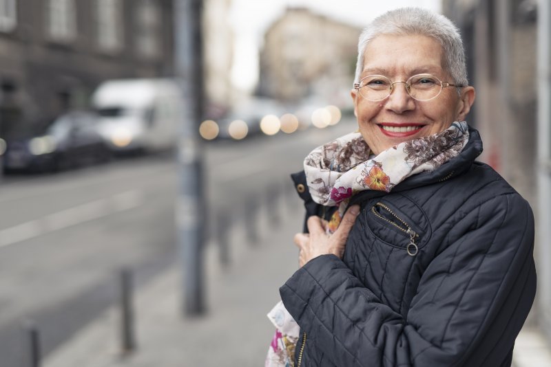 Woman smiling with Invisalign