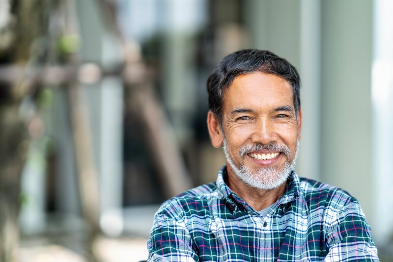 person with dental implants smiling