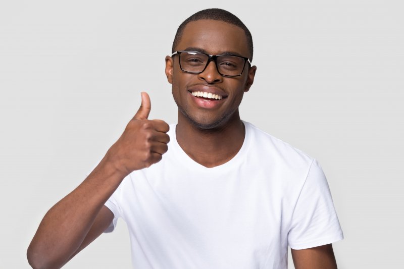 man smiling with veneers in Orange