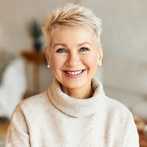 Woman smiling with dentures in Orange