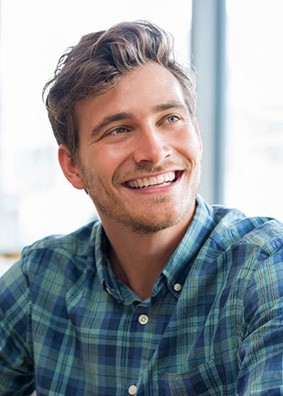 man smiling while talking to person