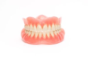 Full set of dentures with white background