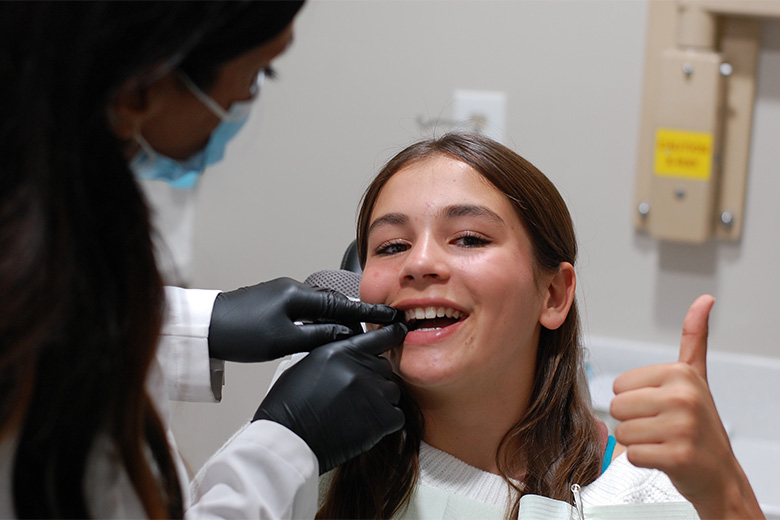 woman talking to her dentist 