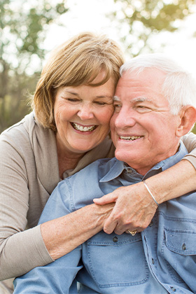 Dentures patient in Orange smiling