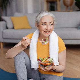 Dentures patient in Orange eating healthy