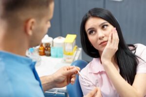 woman at emergency dentist after eating ice