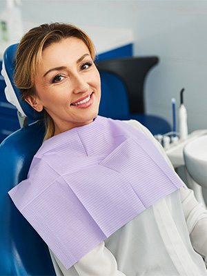 Woman smiling while relaxing in treatment chair.