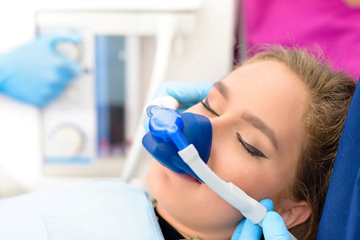 A woman getting dental sedation near Old Towne